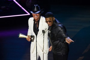 Tim McGraw accepts the ACM Icon Award onstage from Nelly at the 16th Annual Academy of Country Music Honors at Ryman Auditorium on August 23, 2023 in Nashville, Tennessee.